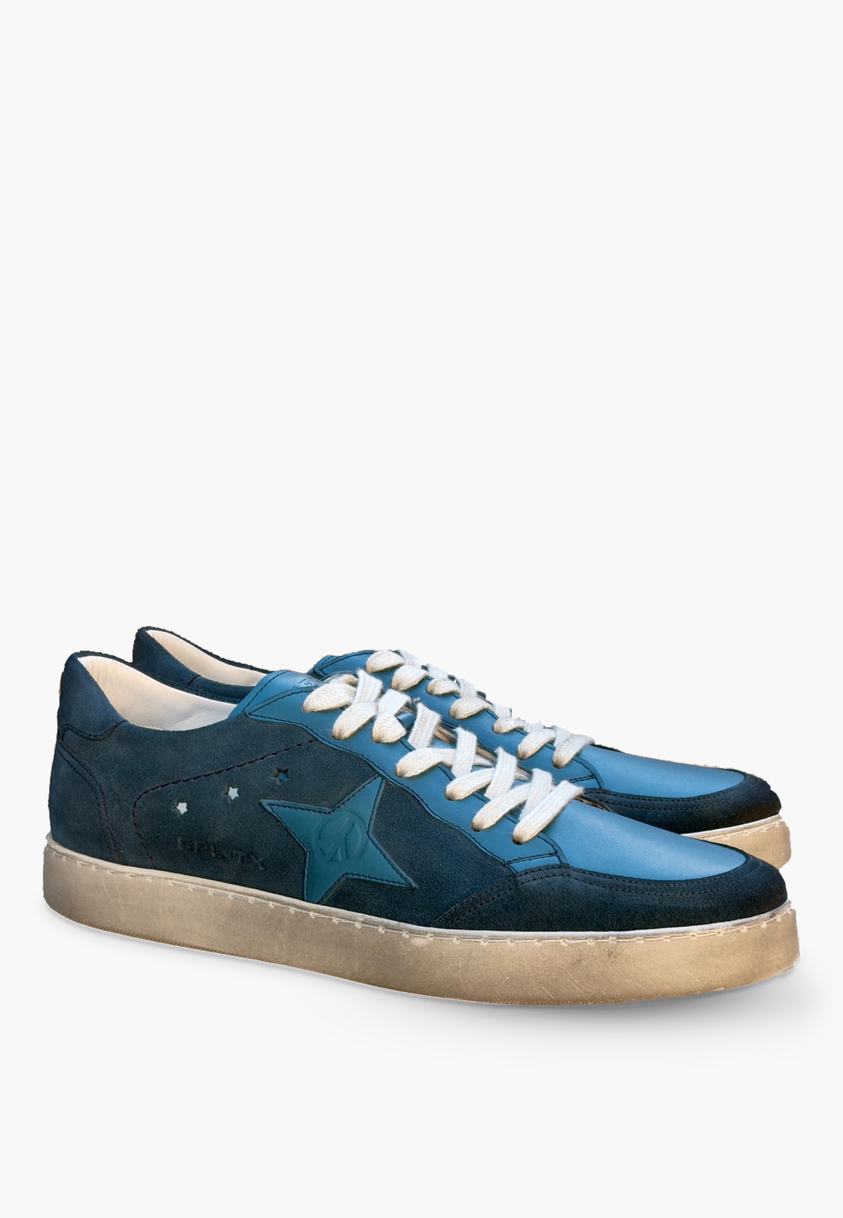 Estrella Sneaker Denim Blue in two-tone suede and leather, with tonal star detail, light-colored laces and lightly distressed soles