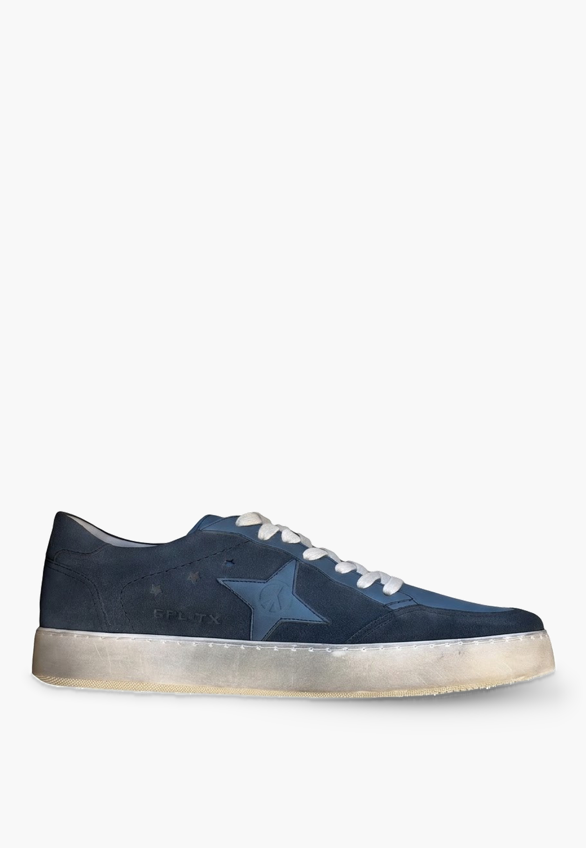 Estrella Sneaker Denim Blue, side view showing tonal star, star-shaped perforations and distressed sole